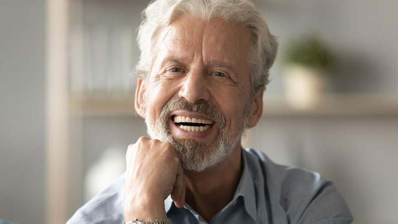 man with implanted dentures